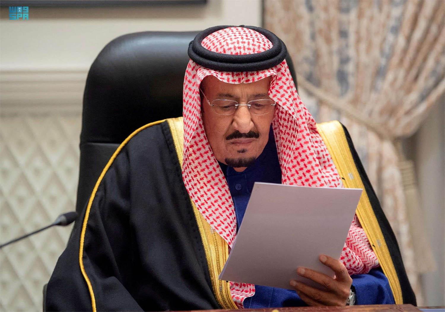 King Salman was briefly shown on state television looking at a big screen