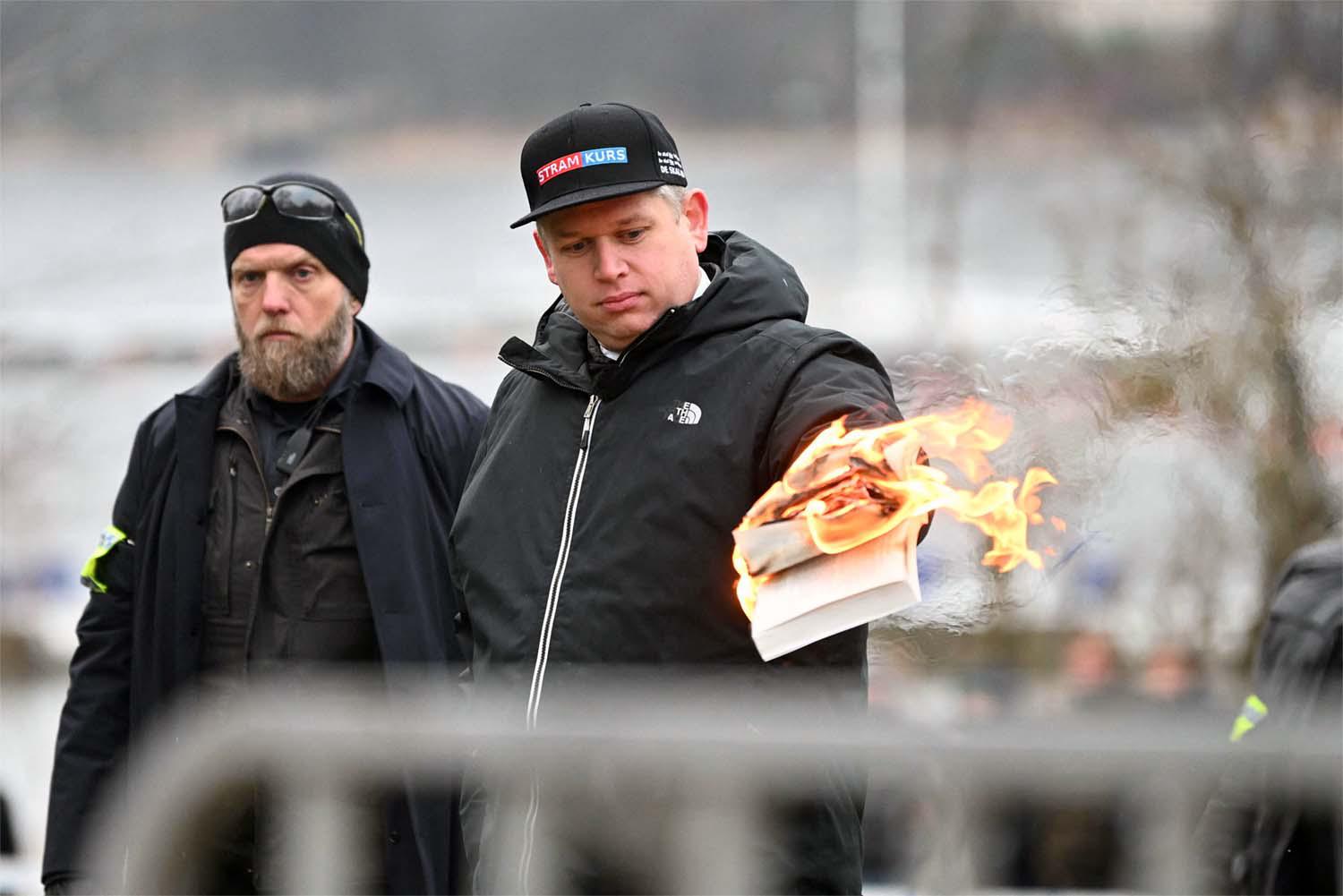 An anti-immigrant politician from the far-right fringe burned a copy of the Koran near the Turkish Embassy in Stockholm