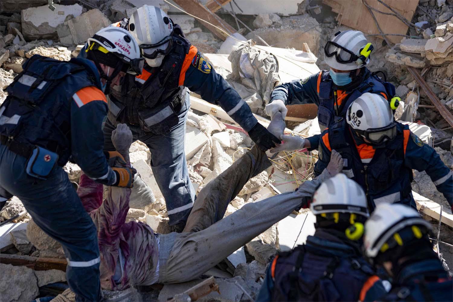 Search teams from more than two dozen countries have joined tens of thousands of local emergency personnel
