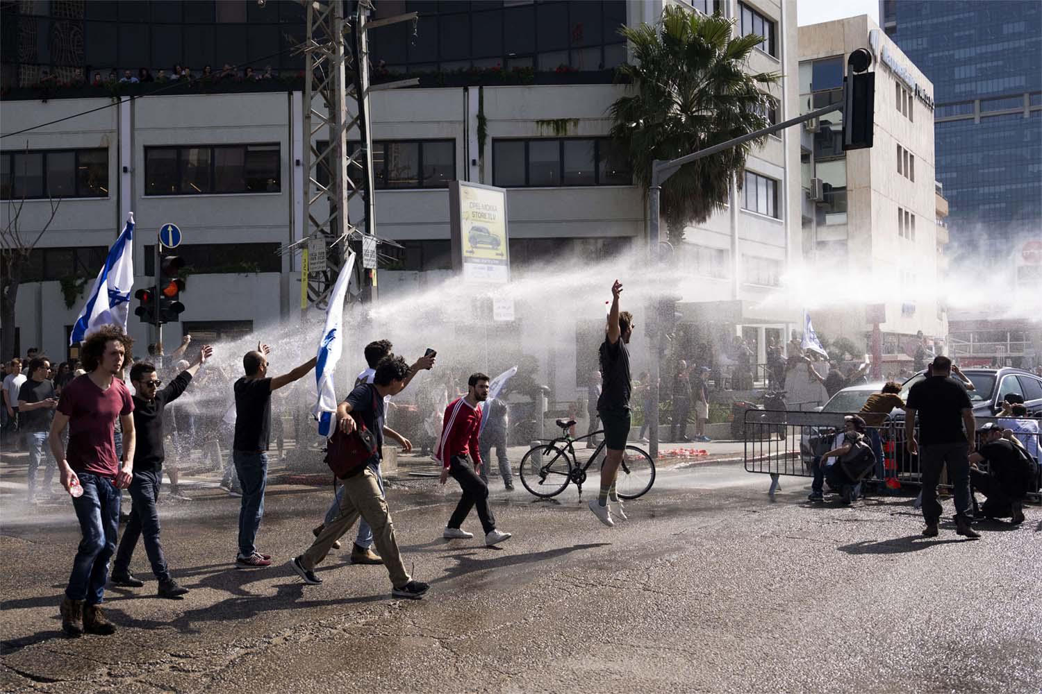 Water cannon to disperse the protests