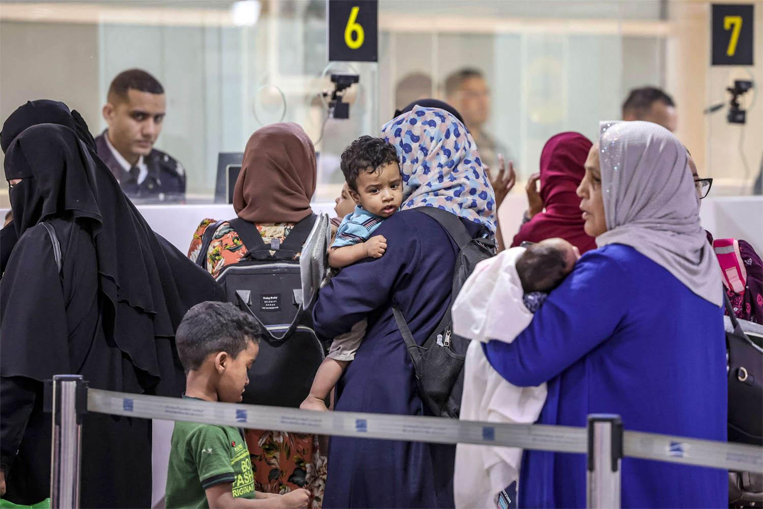 oroccan citizens evacuated from Sudan upon arrival at the Casablanca Mohammed V Airport 