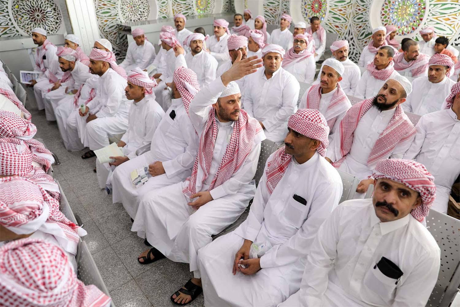 Freed detainees, released unilaterally by Saudi Arabia, sit at Sanaa Airport 