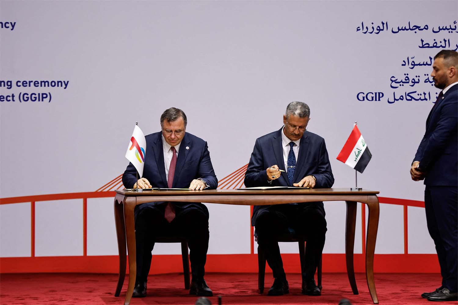 Iraqi Deputy Prime Minister for Energy Affairs and Minister of Oil, Hayan Abdul Ghani Al-Swad and Patrick Pouyanne, Chairman and CEO of TotalEnergies