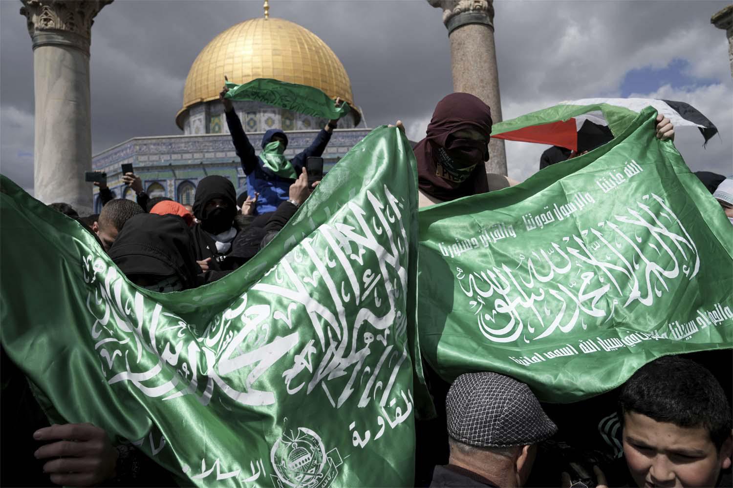 Palestinians display Hamas militant flags