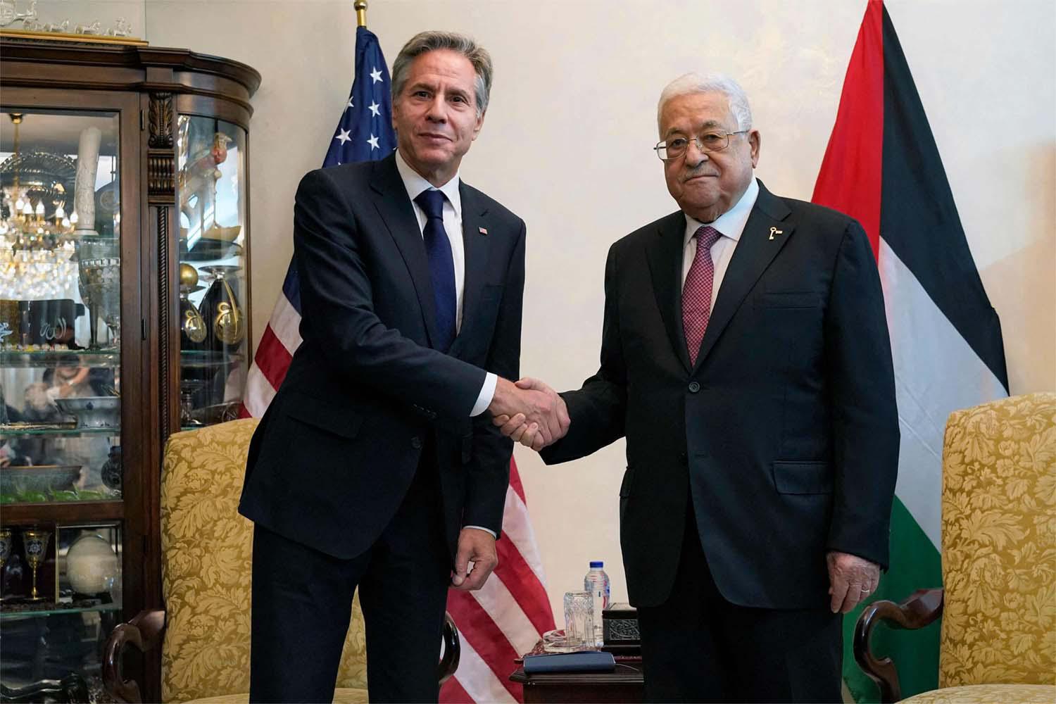 Abbas shaking hands with Blinken