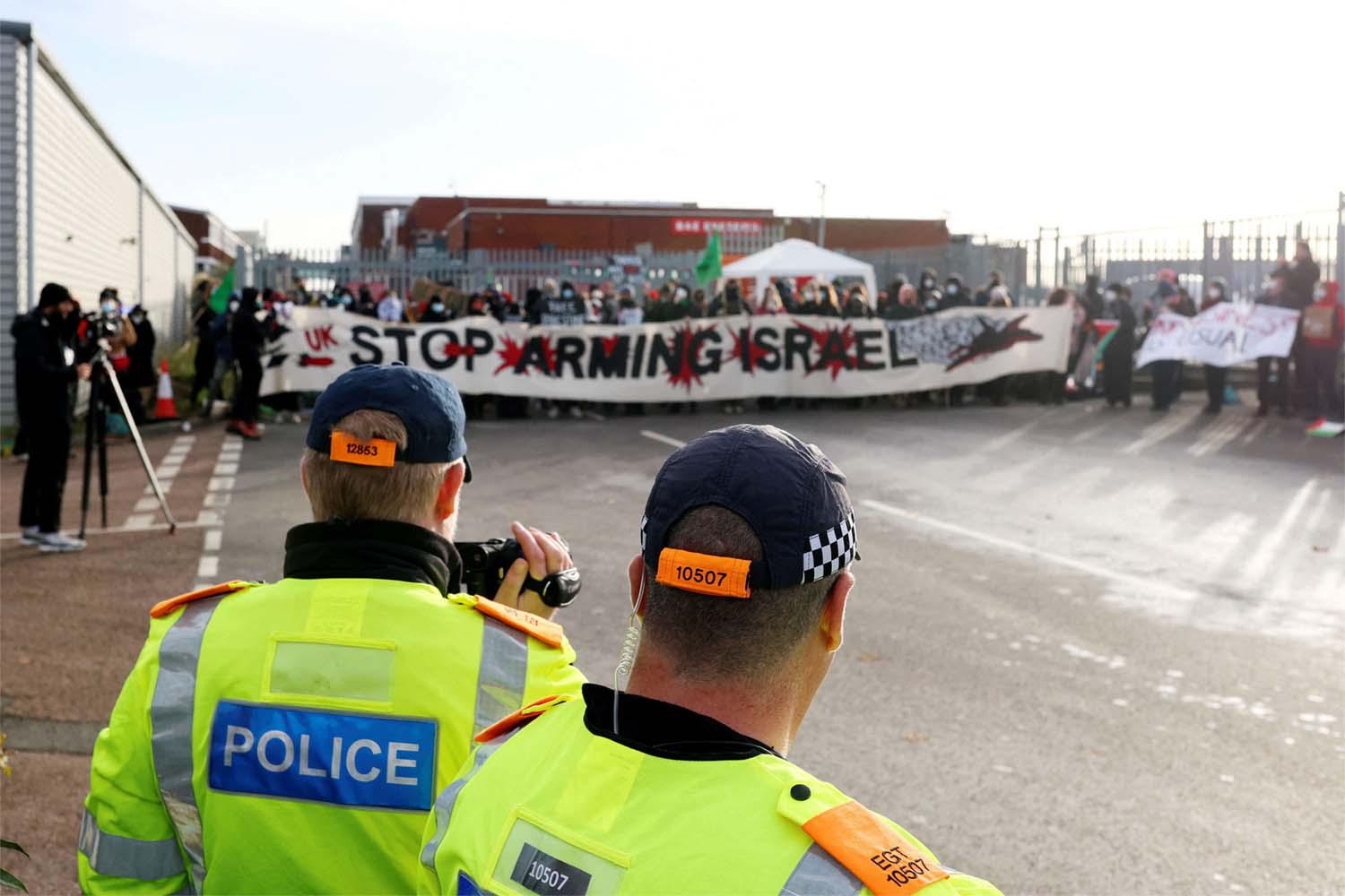 "Stop Arming Israel", reads the banner