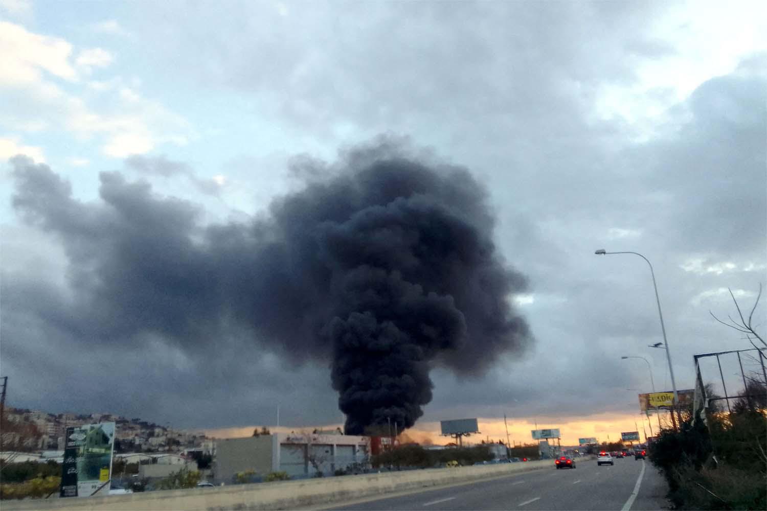 Smoke billows from the site of a reported Israeli airstrike in Ghaziyeh