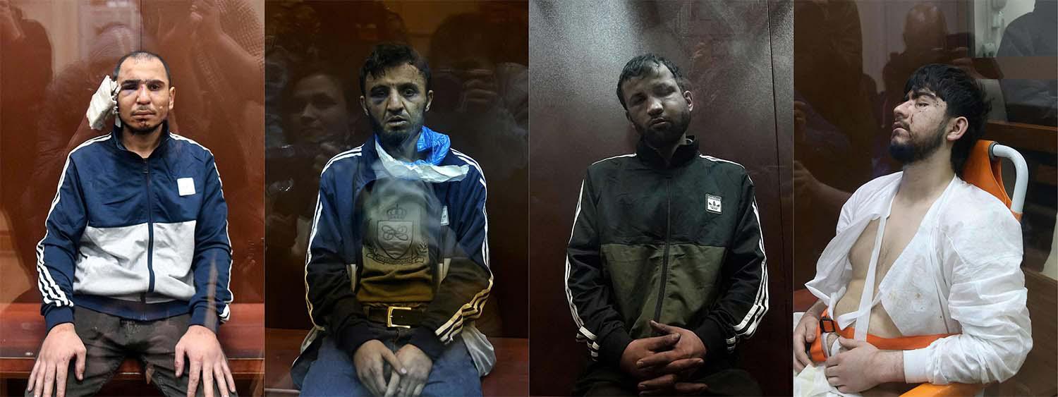 The four suspects sitting inside the defendant cage waiting for their pre-trial detention hearing at the Basmanny District Court in Moscow