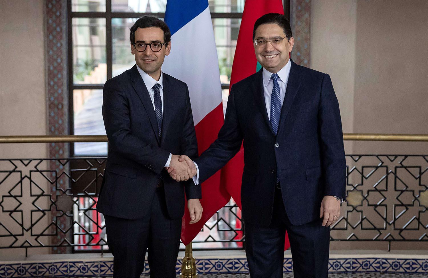 Sejourne shaking hands with Bourita during his visit to Morocco last February