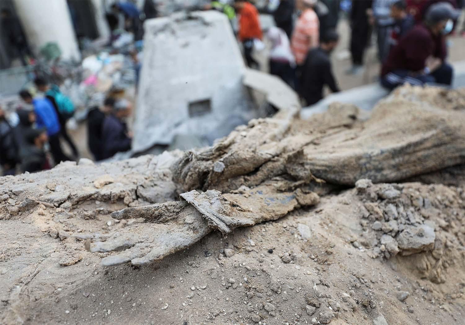 A decomposed body lies on the ground at Al Shifa Hospital after Israeli forces withdrew from the hospital
