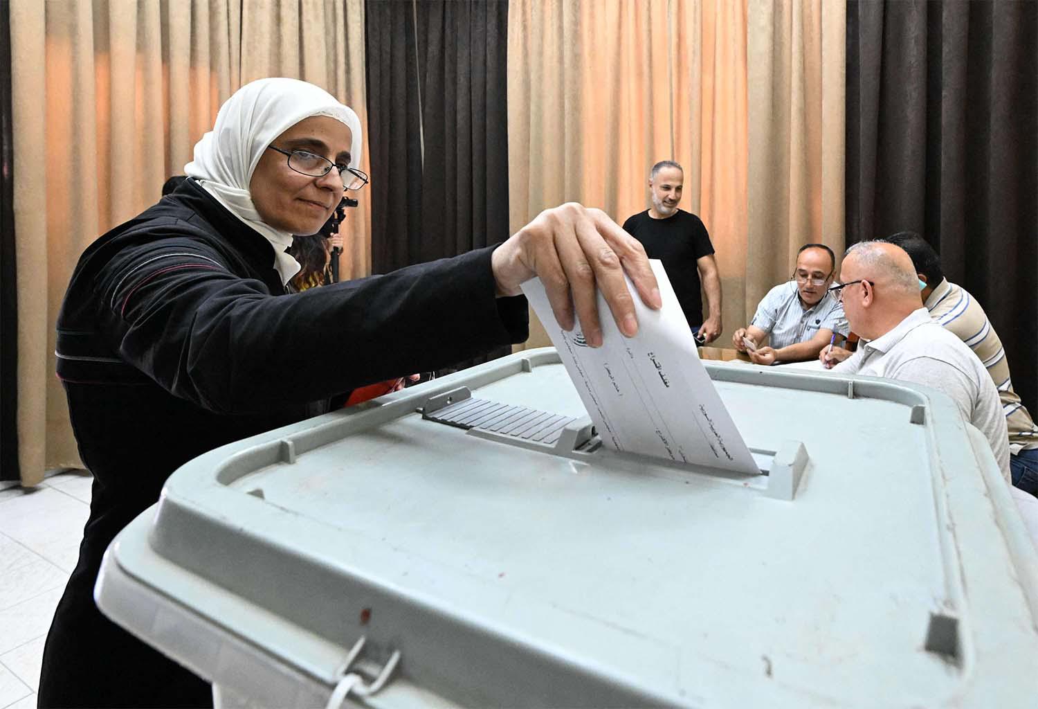Voters are electing 250 lawmakers to parliament, which has little real power in Syria's presidential system