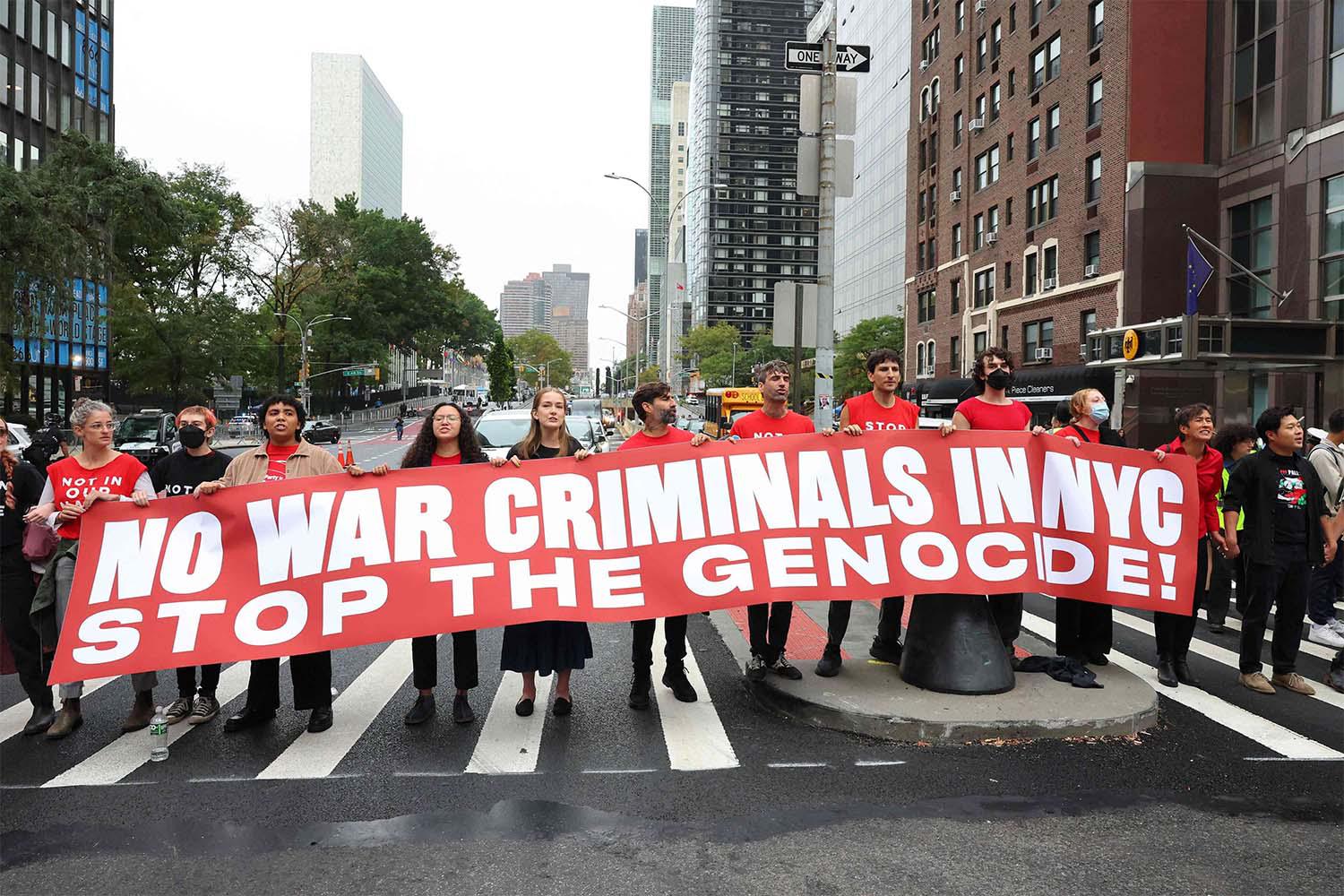 Pro-Palestinian protestors block traffic on First Avenue near the UN headquarters  in New York
