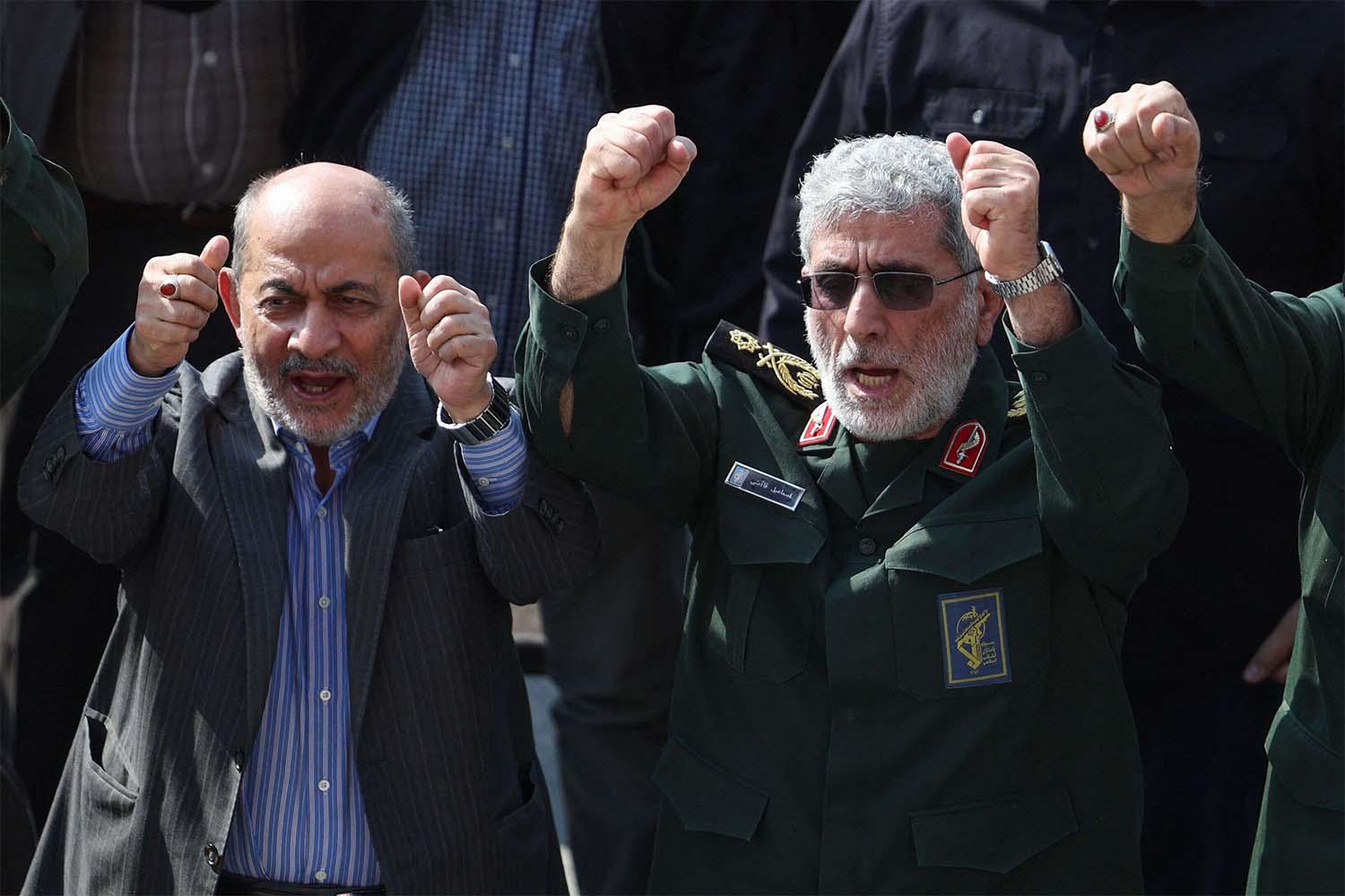 Qaani (R) gestures during the funeral ceremony for slain Guards commander Abbas Nilforoushan in Tehran