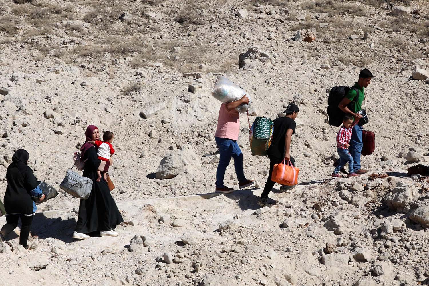 Some 430,000 people have crossed from Lebanon to Syria since Israel's campaign started