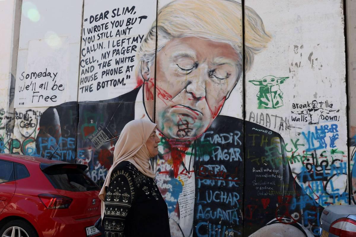 رسم لترامب على الجدار الفاصل بين الضفة الغربية واسرائيل