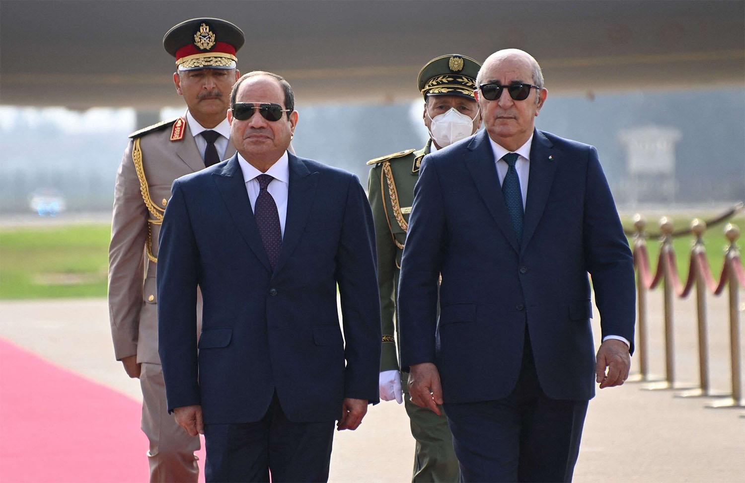 Algerian president Abdelmadjid Tebboune (R) and his Egyptian counterpart Abdel Fattah al-Sisi