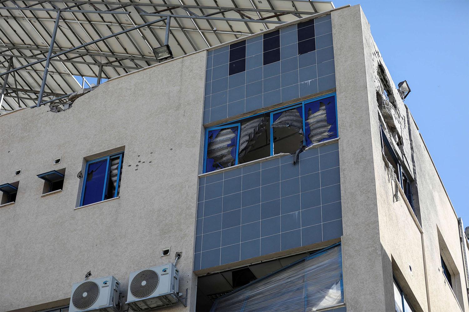 Al-Ahli Arab Baptist hospital stands damaged following an Israeli strike