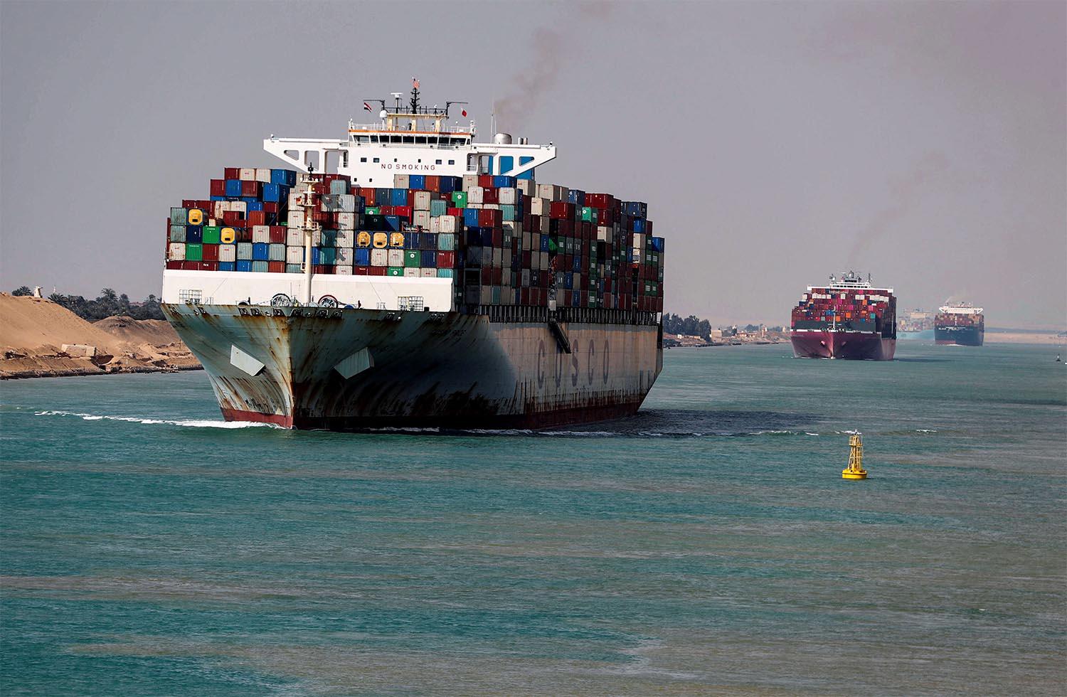 Shipping containers pass through the Suez Canal in Suez, Egypt 