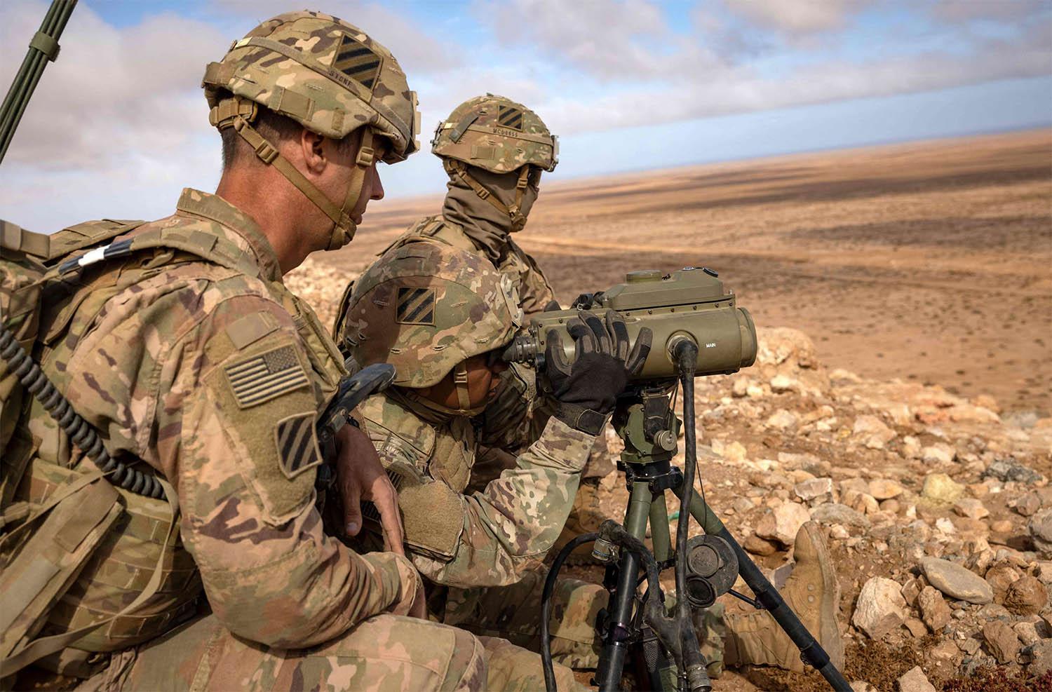 US army soldiers stand at an observation point during the African Lion military exercise in Morocco's Tan-Tan region