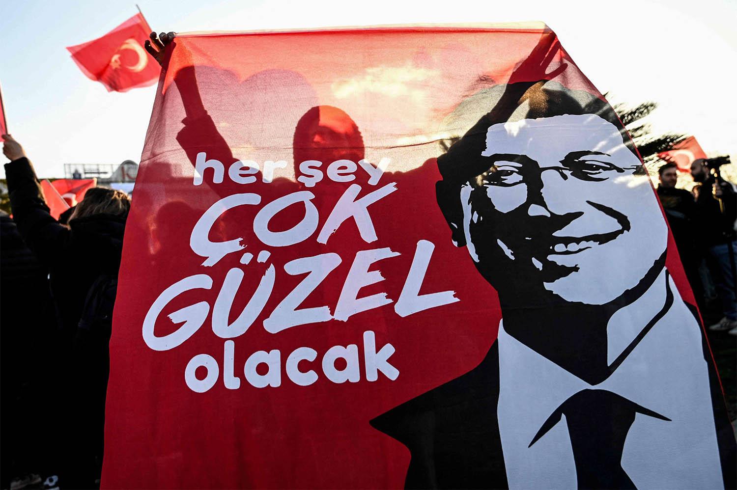Supporters of Istanbul Mayor Ekrem Imamoglu take part in a demonstration outside Istanbul municipality against his detention over a corruption probe