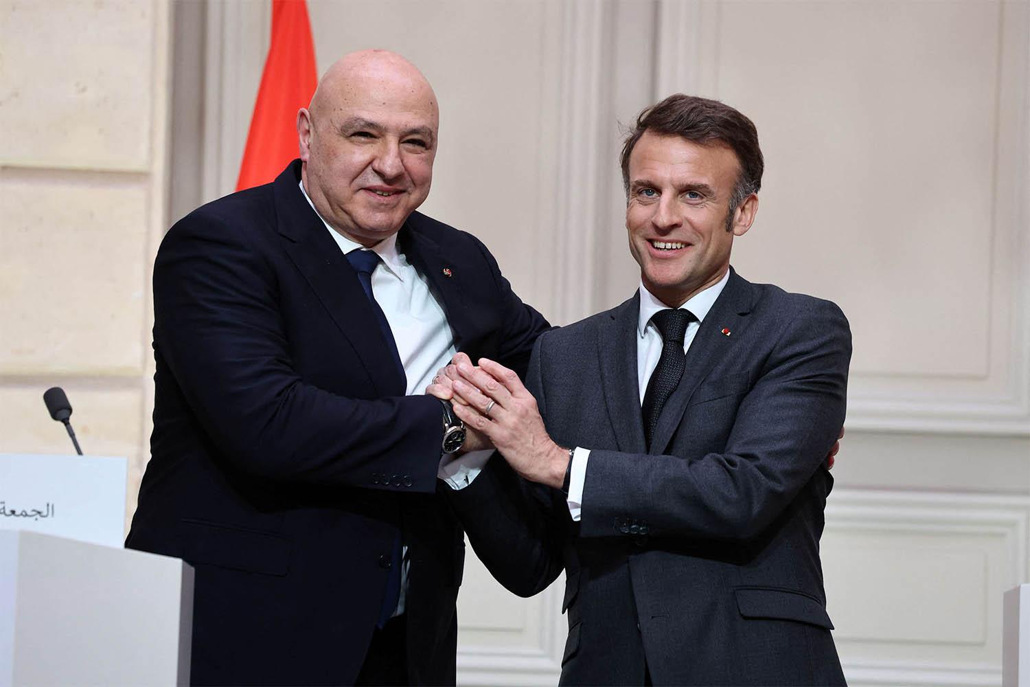 French President Emmanuel Macron and Lebanese President Joseph Aoun shake hands during a joint press conference