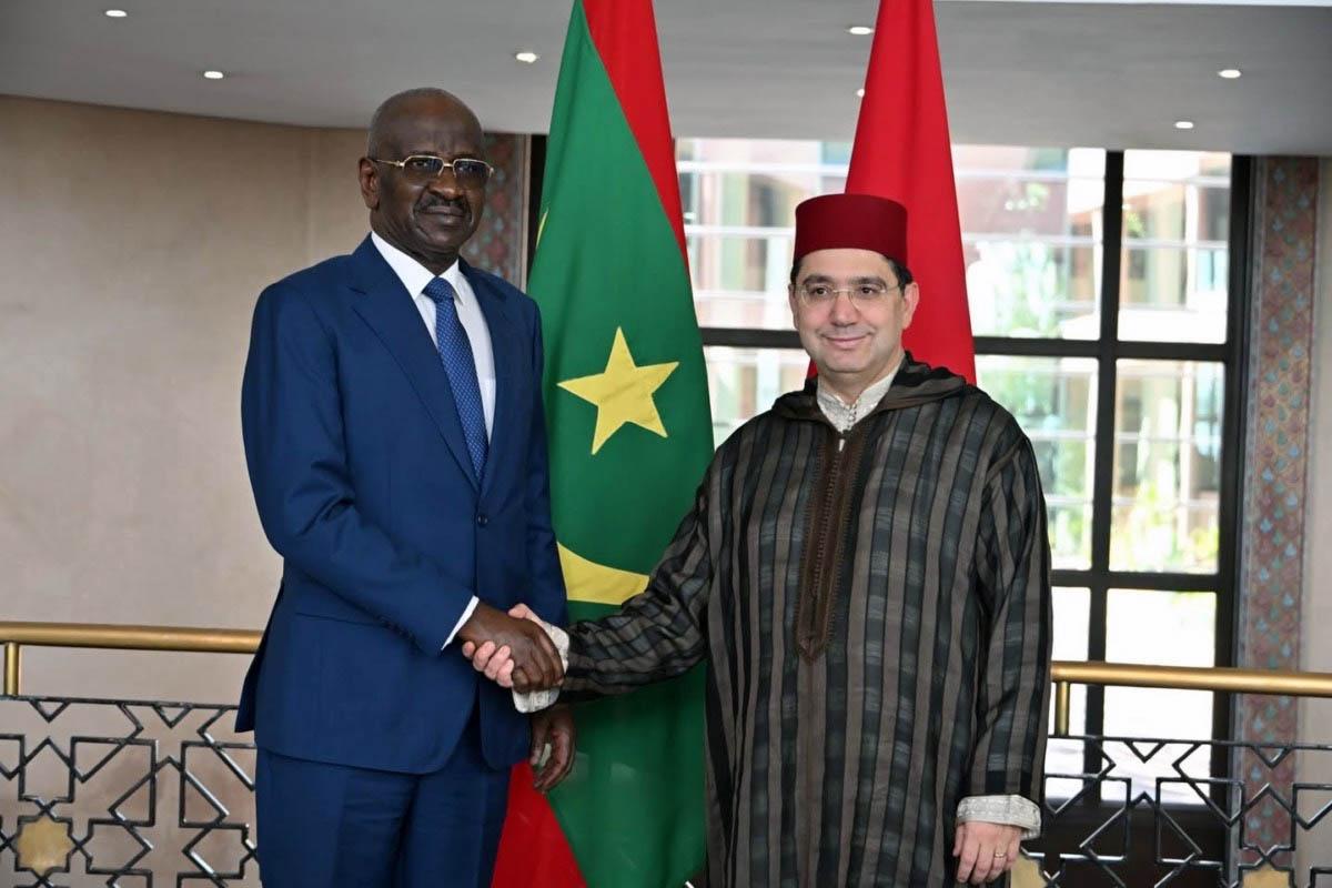 Ould Merzoug shaking hands with Bourita at Morocco's foreign ministry