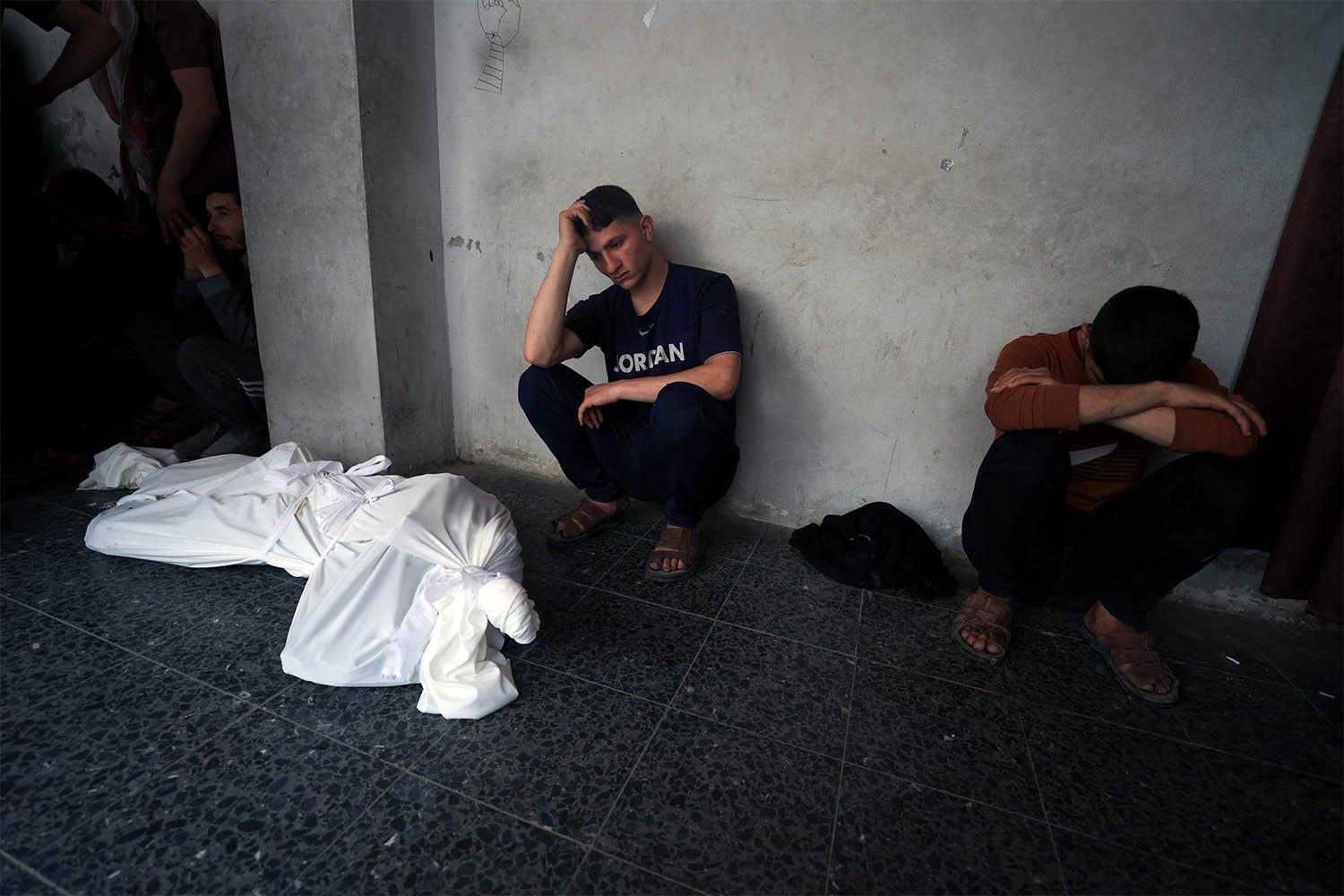 Mourners react during the funeral of Palestinians killed in Israeli strikes, at Al-Ahli Arab Baptist hospital, in Gaza City