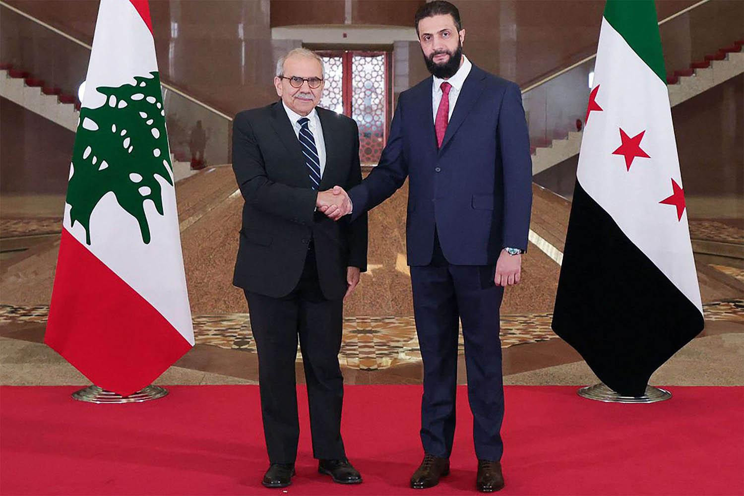 Sharaa shaking hands with Salam