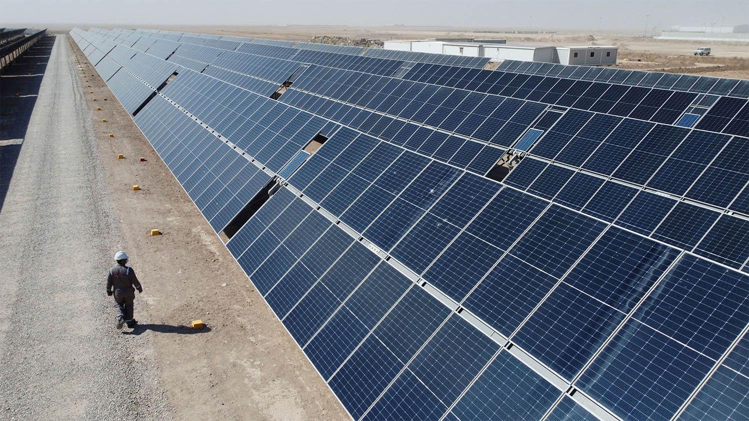 A general view shows solar panels at the Faihaa oil field in Basra