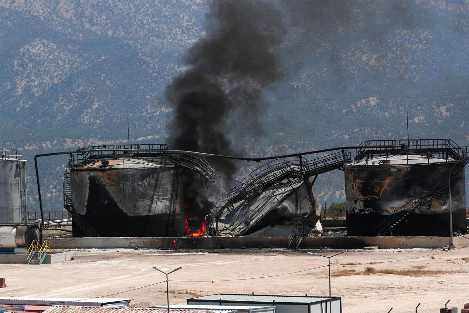 Smoke billows from a damaged oil installation at the Sarsang oil field following a drone attack on the Chamanke district in Iraq's Kurdistan