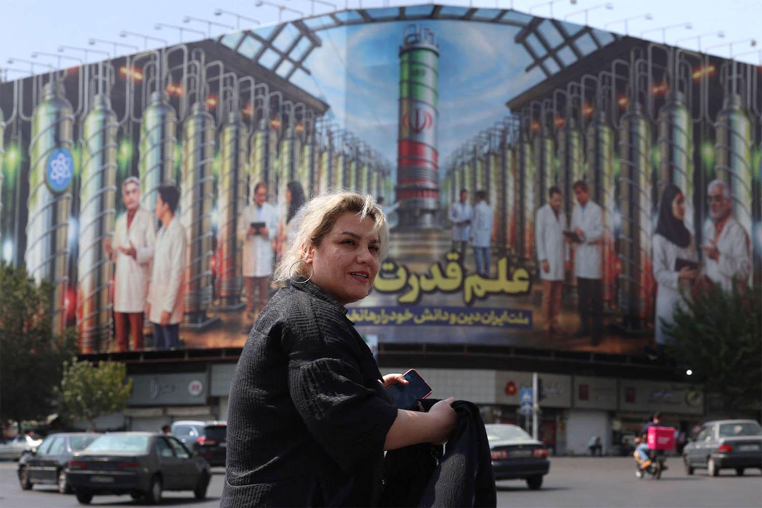 A billboard displaying in Tehran pictures of nuclear scientists, centrifuges and a sentence reading in Farsi: Science is the power