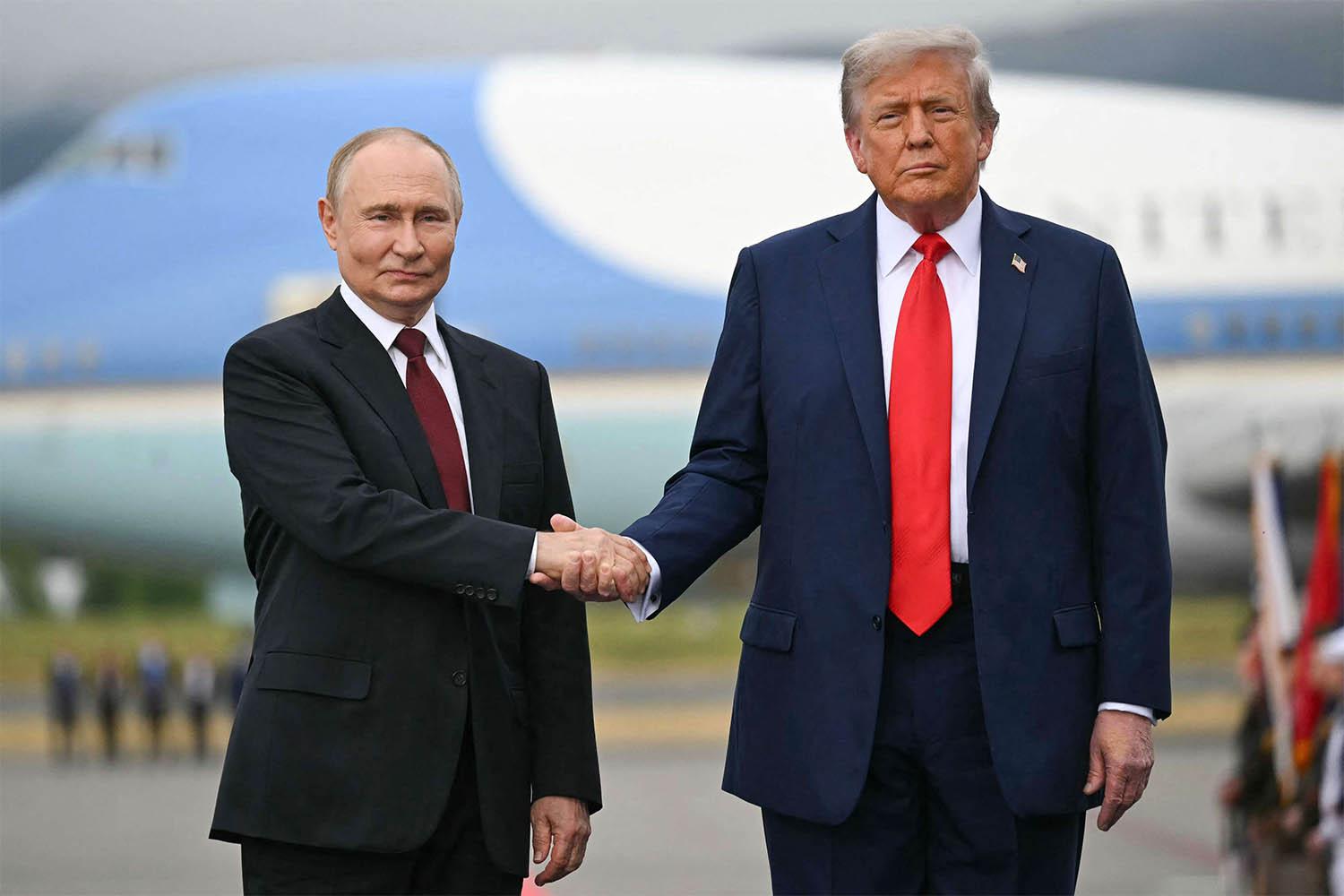 Putin shaking hands with Trump