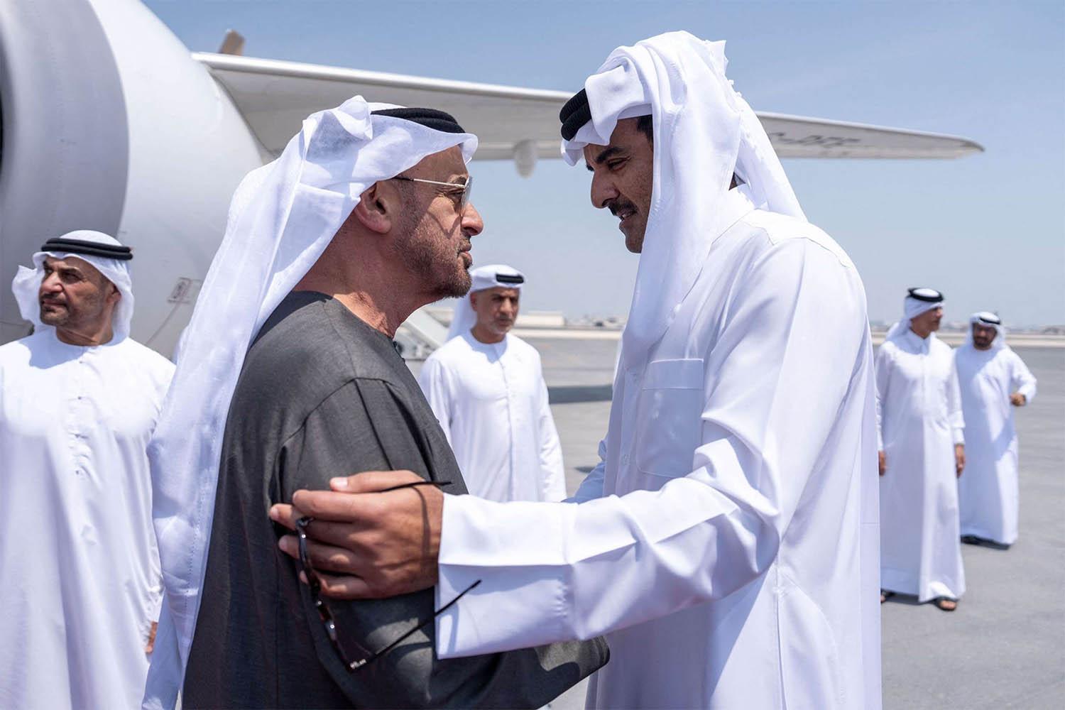 atar's Emir Sheikh Tamim bin Hamad al-Thani (R) welcoming UAE President Sheikh Mohamed bin Zayed al-Nahyan in Doha on September 10