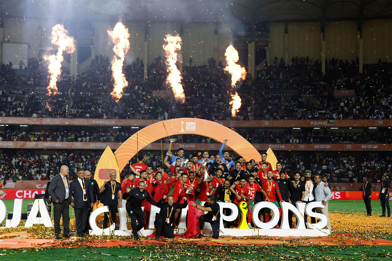 Morocco's players and team celebrate their victory at the end of the African Nations Championship (CHAN) final football match between Madagascar and Morocco
