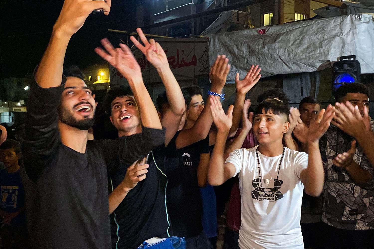 Gazans celebrate the ceasefire announcement