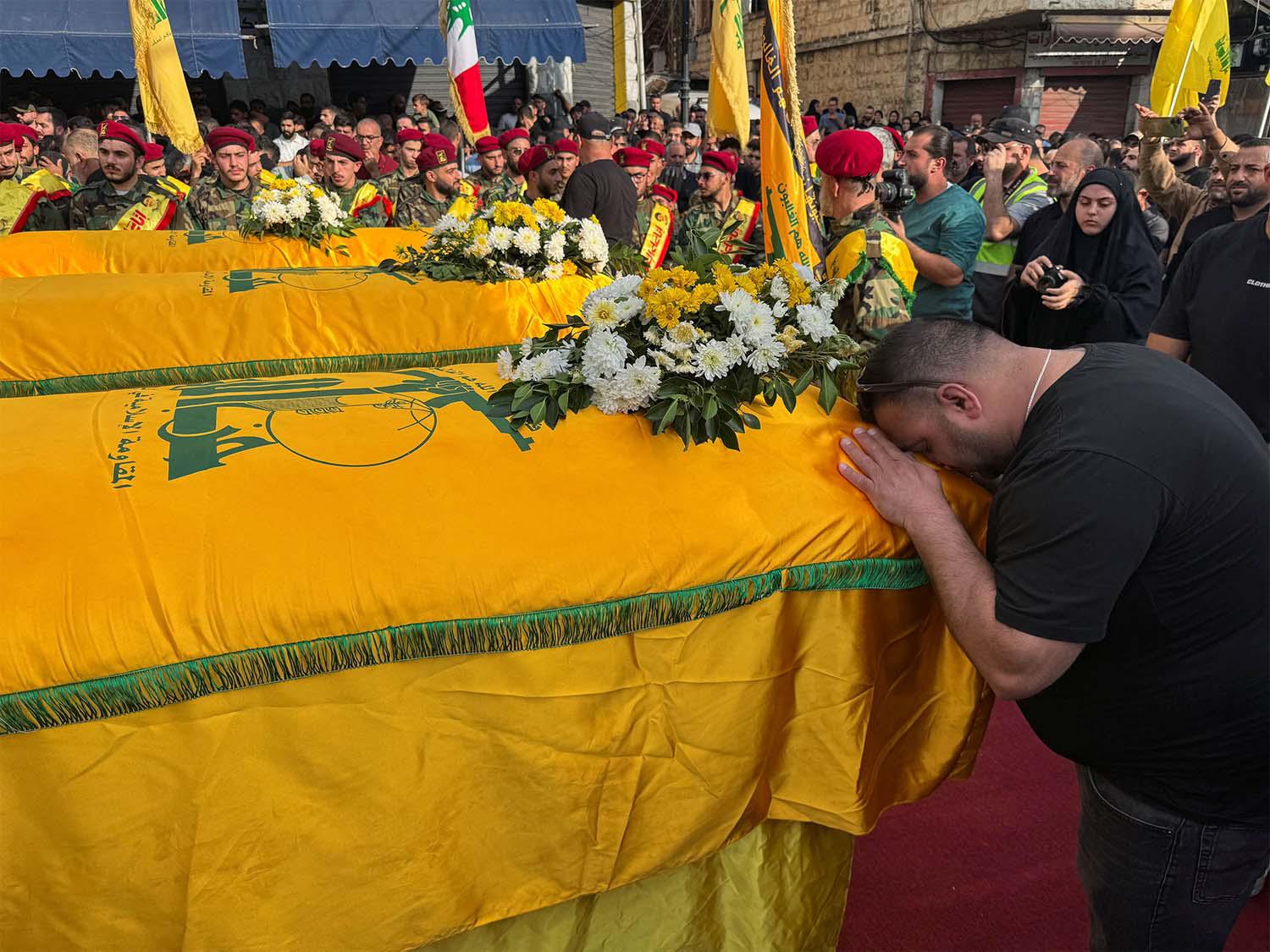 People mourning Hezbollah members killed in recent Israeli attacks