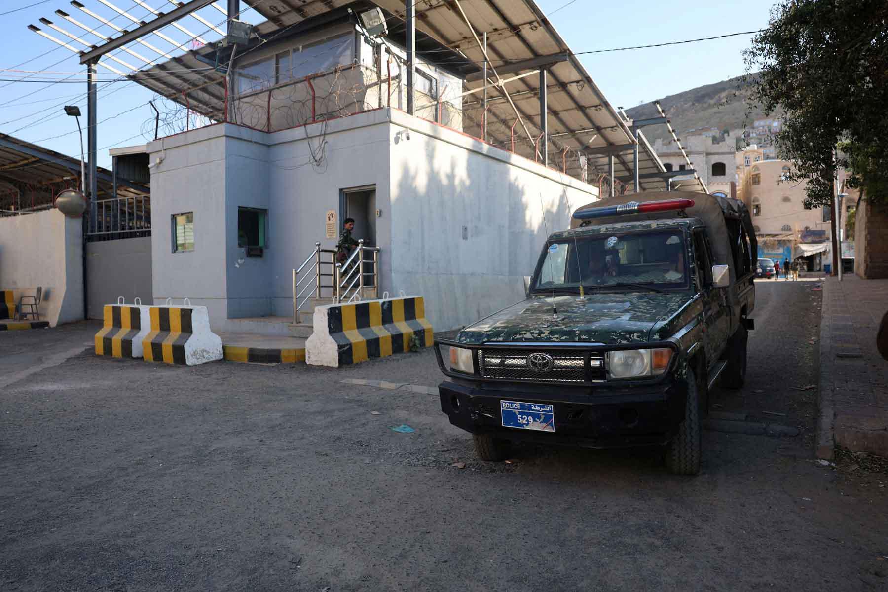A police patrol vehicle is parked outside the United Nations’ compound following reports of UN staffers being detained by the Houthis, in Sana’a, October 29, 2025.