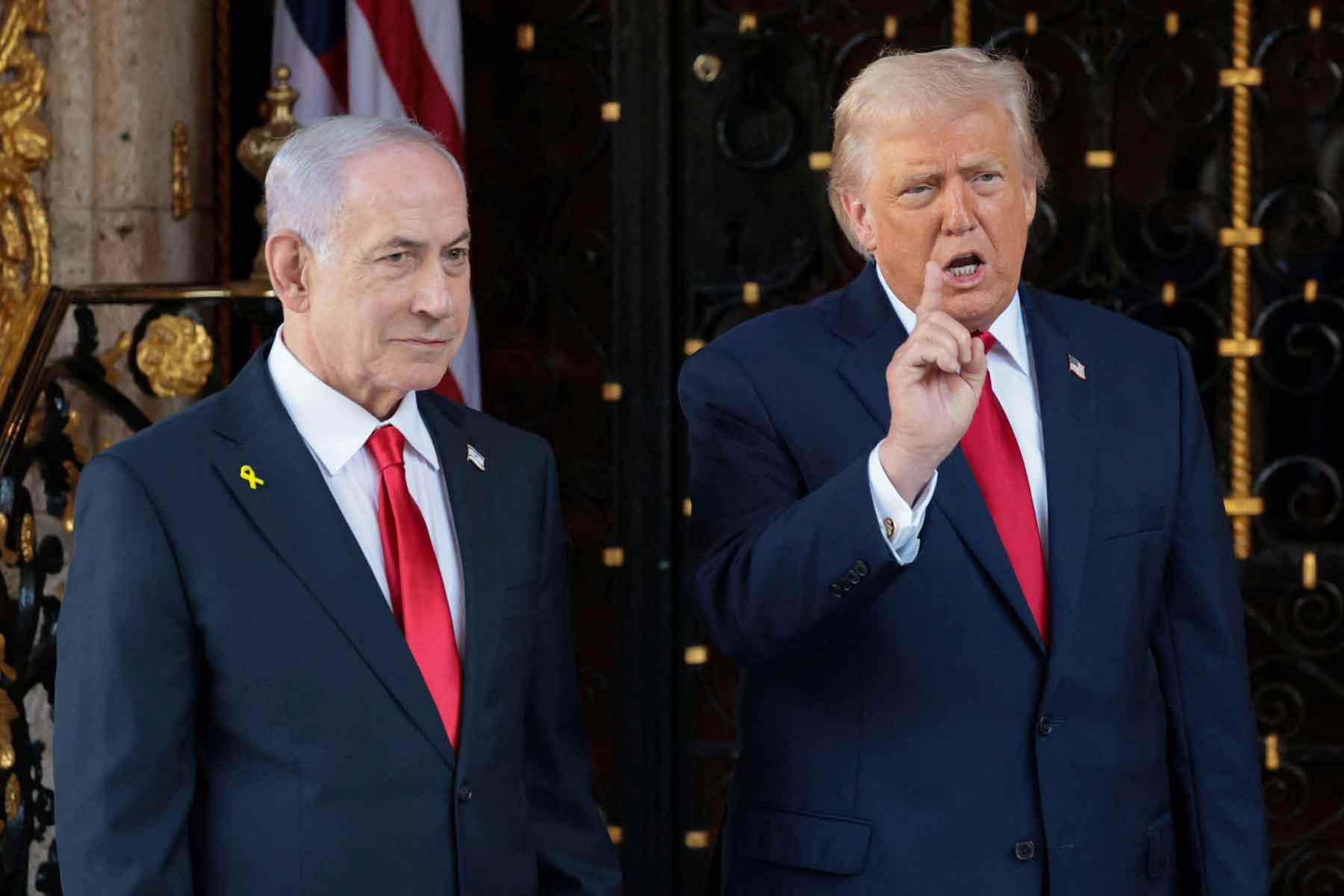 US President Donald Trump speaks to the media next to Israeli Prime Minister Benjamin Netanyahu upon arrival for meetings at Trumps Mar-a-Lago club in Palm Beach, Florida, December 29, 2025. 