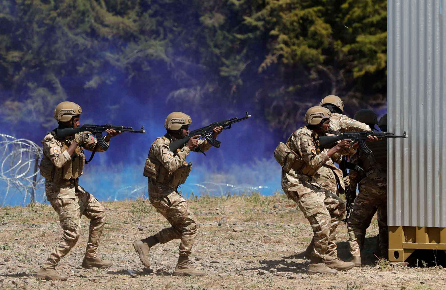 Multinational soldiers participate in a training during an exercise, aimed at enhancing combat readiness and crisis response, at the Umoja village within the Counter Insurgency Terrorism and Stability Operations centre in Nanyuki, Laikipia County, Kenya. 