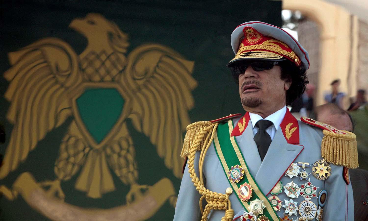 Late leader Muammar Gaddafi attends a celebration of the 40th anniversary of his coming to power at the Green Square in Tripoli September 1, 2009