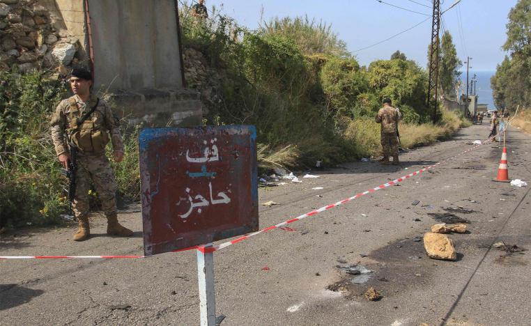 Lebanese security forces set up a checkpoint on the road leading to the scene of an Israeli airstrike in Baawert on April 22