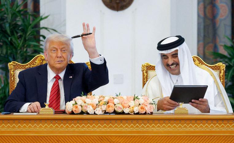 US President Donald Trump and Qatar's Emir Tamim bin Hamad Al Thani attend a signing ceremony in Doha